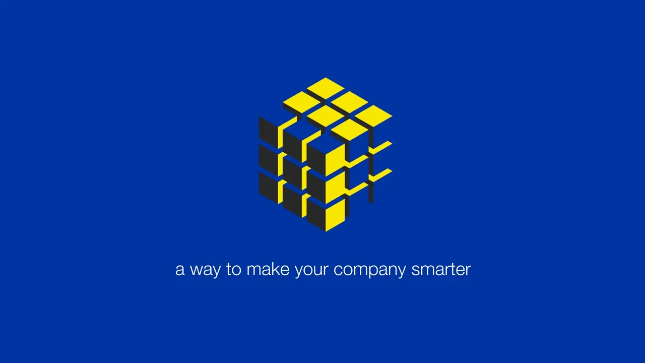 Animated clip of a stylized Rubiks cube rendered in a three-dimensional flat color aesthetic over a deep blue background solving itself
